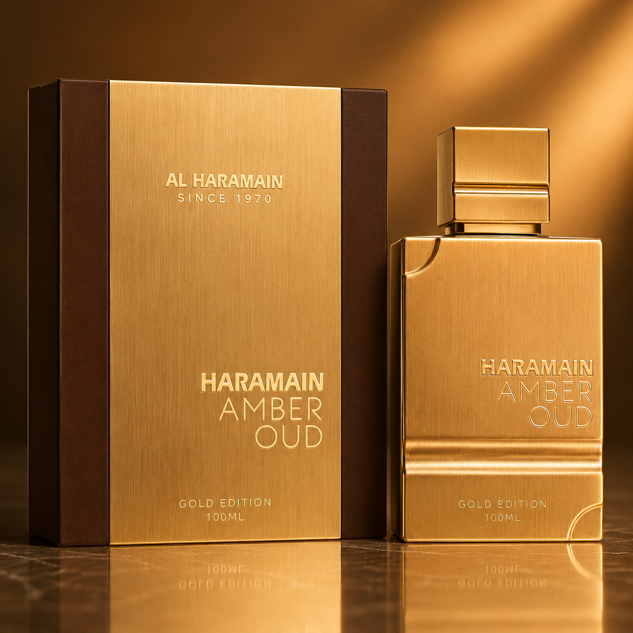 Haramain Amber Oud perfume bottle and packaging on a reflective surface with a warm glow.