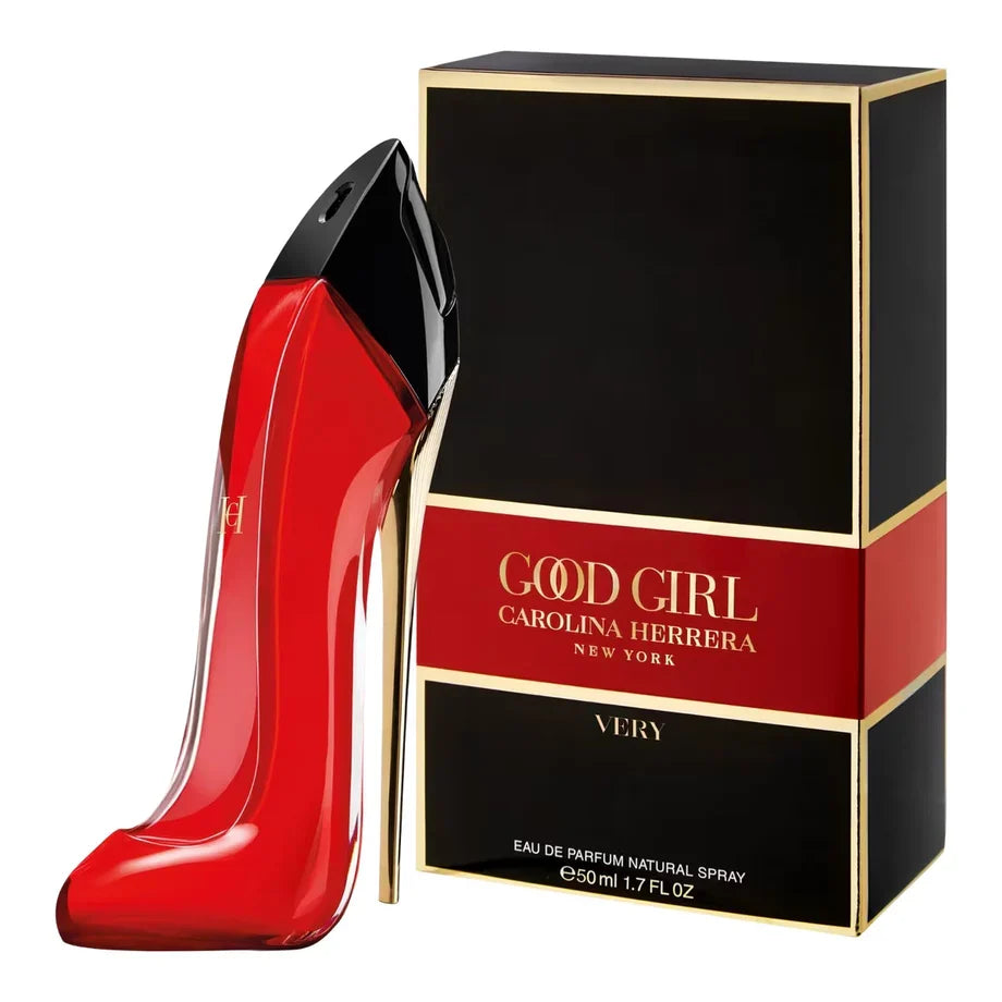 Red high-heeled shoe-shaped perfume bottle with black cap next to its packaging on a white background